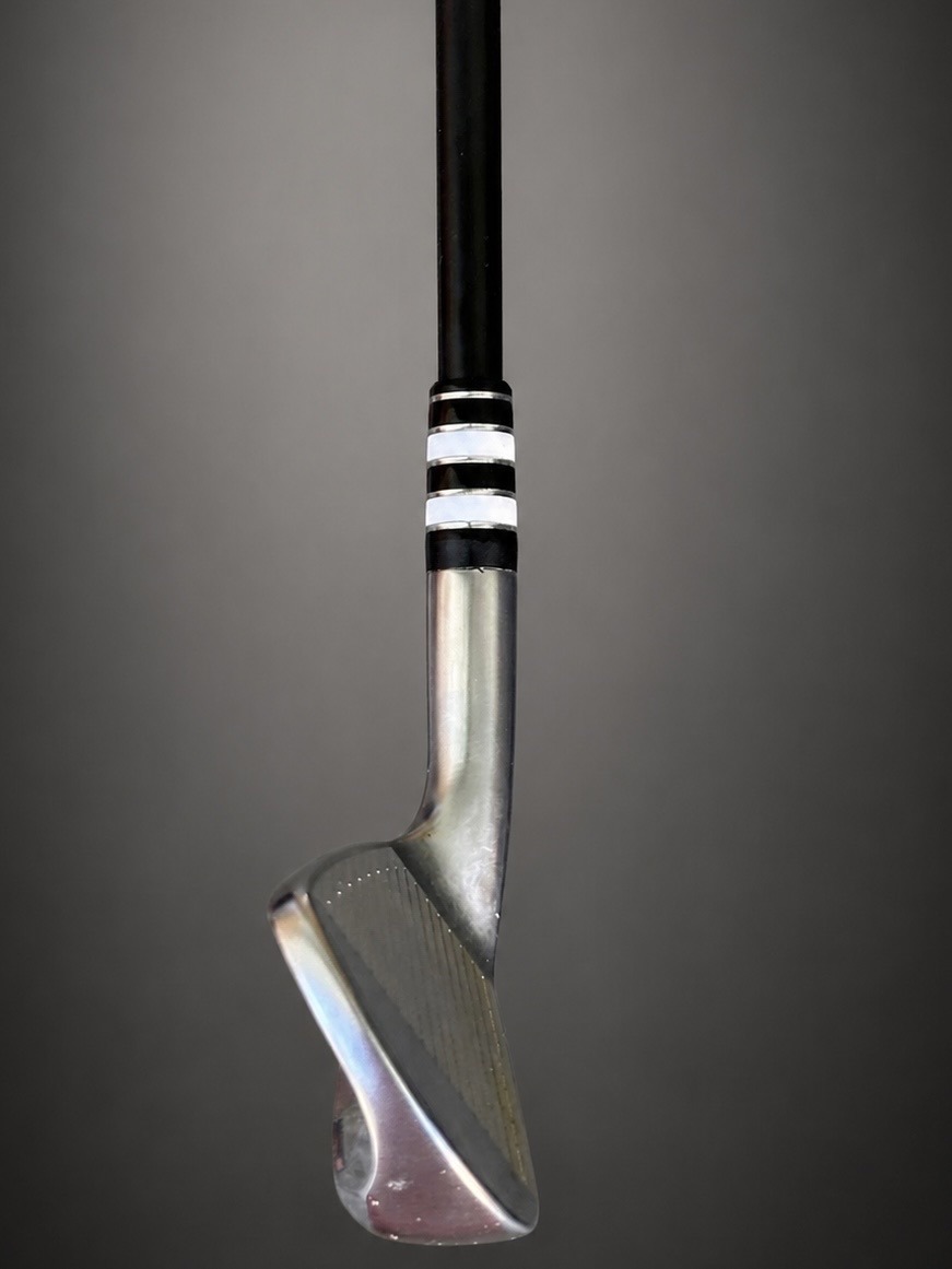 A Classy Jailbird ferrule installed on an iron, seating the black shaft into the polished hosel.